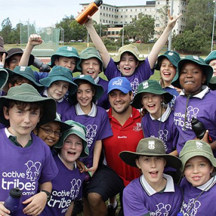 Queensland Reds player and UQ student James Hanson with students from St Ita’s Primary School at the Active Tribes launch