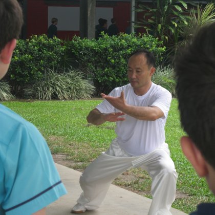 Students learn from a Taichi master’s demonstration during Chinese New Year celebrations 