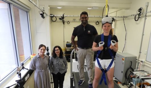 In the UQ neuromuscular biomechanics laboratory with the VR balance rig are (from left) Associate Professor Taylor Dick from the School of Biomedical Sciences, Senior Lecturer Dr Nilufar (Nell) Baghaei from the School of Electrical Engineering, Electrical Engineering and Computer Science PhD scholar Achintha Abayasiri and UQ research scholar Anastasia Polach. Credit: UQ