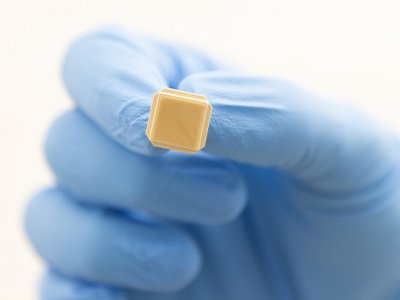 An image of the Vaxxas high-density microarray patch (HD-MAP) technology, showing a small patch containing thousands of microprojections.