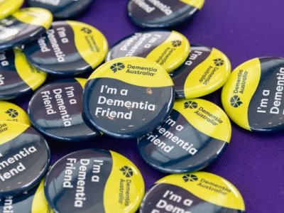 Close up of a button that says 'I'm a dementia friend'