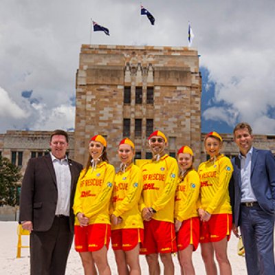 CEO of SLSQ John Brennan and UQ Vice-Chancellor Professor Peter Høj with SLSQ volunteers