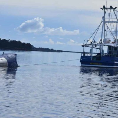 A tidal energy turbine being towed out to a site in the Tamar