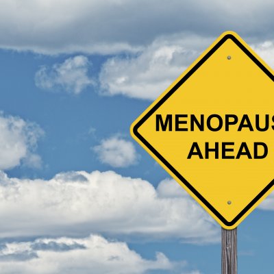 A road sign reads 'Menopause ahead'