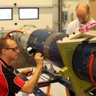 Brad Sharp, Dr Melrose Brown and Dr Michael Creagh from the SCRAMSPACE team work to finalise the payload for the upcoming launch. Credit: Donald Cook.