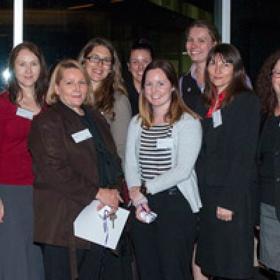 Chancellor Mr John Story presents 2013 Miracle Worker awards to group winners from the Faculty of Social and Behavioural Sciences. (<i>Back from left:</i> Sally Clark, Christine McCoy, Heidi Hood, Erin Zielke, Bianca Ohlson, Holly Dennis. <i>Front from left:</i> Kaylene Power, Chloe Burton, Melinda Conlan, Jane Fisher, Rachelle Croton.)