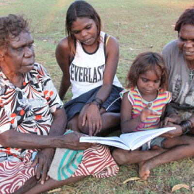 Sylvia Inverway and her daughters reading the new book with one of the authors Violet Wadrill (Photo: Penny Smith)