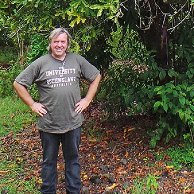 Dr Craig Hardner with a macadamia tree in Hawaii