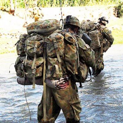 Mentoring and Reconstruction Task Force 2 soldiers cross one of many rivers whilst on patrol through Sorkh Lez in the Mirabad Valley, Southern Afghanistan. Photo by Corporal Rachel Ingram