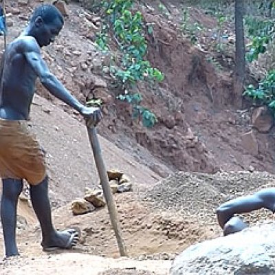 Small-scale miners sifting through crushed rock in Sierra Leone. Image supplied courtesy of the Sierra Leonean Broadcasting Company