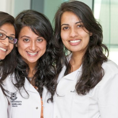 UQ first year pharmacy students Ms Ila Patel (accelerated student); Ms Natasha Kissoon and Ms Mandeep Kaur Rao (accelerated students) received their white coats at a recent welcoming ceremony.