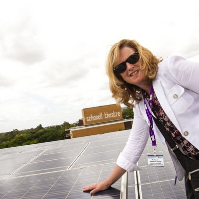 Professor Katherine Pancak from the University of Connecticut checks out UQ's 1.22 megawatt photovoltaic solar array, which generates electricity for the St Lucia campus in Brisbane.