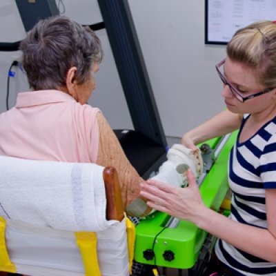 UQ PhD student Kate Hayward from the School of Health and Rehabilitation Sciences helps a stroke patient use SMART Arm, a device developed by UQ and James Cook University to assist stroke survivors with their rehabilitation.