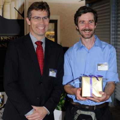 UQ Vice Chancellor Peter Høj congratulates Information Technology Services Network Operations and Incident Response Manager Chris Teakle for his 25-year service at the University.