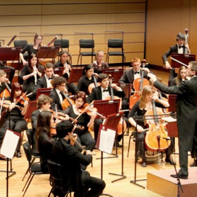 UQ Symphony Orchestra with conductor, Warwick Potter.