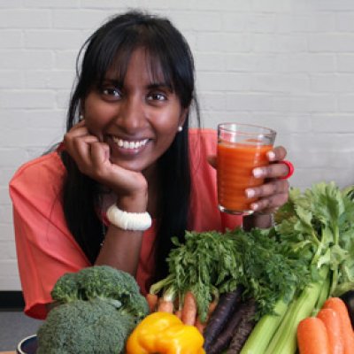 Dr Anneline Padayachee with orange carrot juice and other vegetables included in her research.