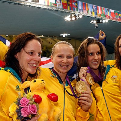 From left: Alicia Coutts, Melanie Schlanger, Brittany Elmslie and Cate Campbell pose with their gold medals after winning the women's 4x100m freestyle relay final. Image AAP/EPA