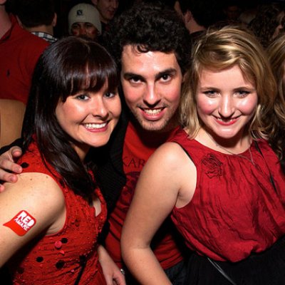 From left, Claire Mohr, Steve Ashburn and Tara Malcom dress in red for last year's TIME Red Party.