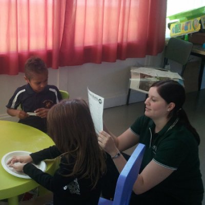 UQ occupational therapy student, Kirsty Bailey, with a group of children from The Murri School