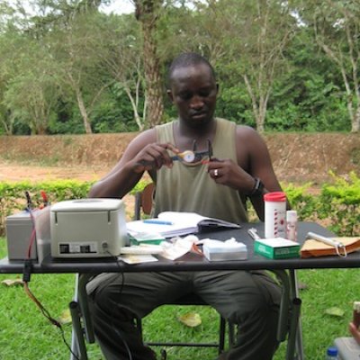 UQ PhD student Justus Deikumah measure the bill-skull length of a Grey-Headed Bristlebill in South-West Ghana as part of his study of the health of birds post rainforest clearing.