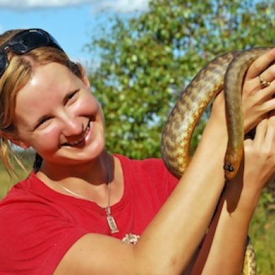 Melissa Bruton with a woma python (Aspidites ramsayi) out in the southern Brigalow Belt of Queensland and New South Wales.