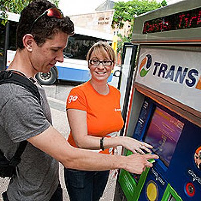 TransLink representative Jessica Brown helps Bachelor of Science student Joshua Horsley use the machine
