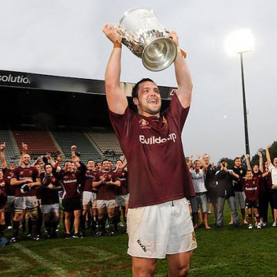 UQ Captain James Hanson holds up the Hospital Cup. Photo by Tomme Hanson