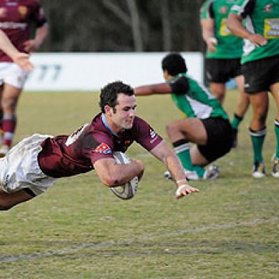 UQ fly-half Jonathon Lance dives for the line against Sunnybank. Image: Tomme Hanson