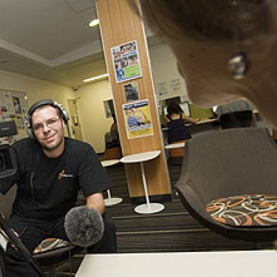 Journalisim students Kim Smith and Adam Evans interview Brenda Nadjiwan at World Press Freedom Day