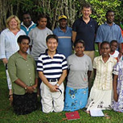 Professor Ian Frazer (back centre) and Clinical Trials Research Manager James Pang (front left) in Vanuatu with the health team and local teachers