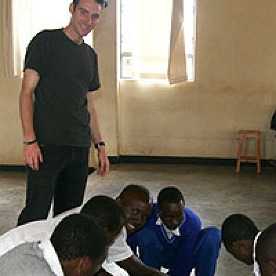 UQ medical student Sean Mitchell working with high school students in Rwanda