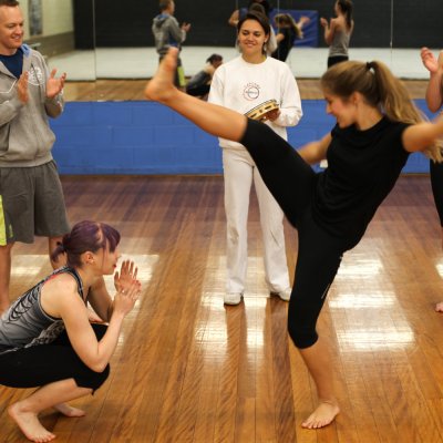 UQ Sport staff participate in capoeira, a type of Brazilian martial art