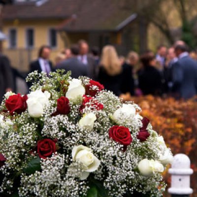 The public response to the death of two Sydney siege hostages has seen an outpouring of floral tributes.