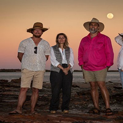 (L-R) Filmmaker Mark Jones, curator Marion Vasseur Raluy, UQ palaeontologist Dr Steve Salisbury and artist Angelika Markul, surrounded by dinosaur tracks on Roebuck Bay. Credit: Damian Kelly.  