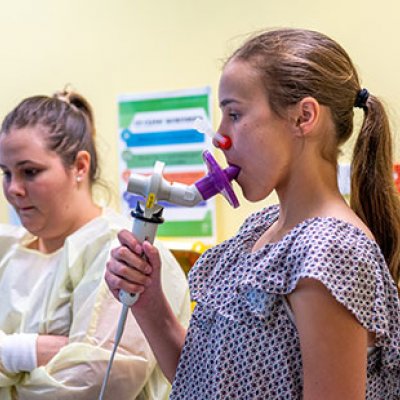 Mya Dunn performing a breathing exercise 