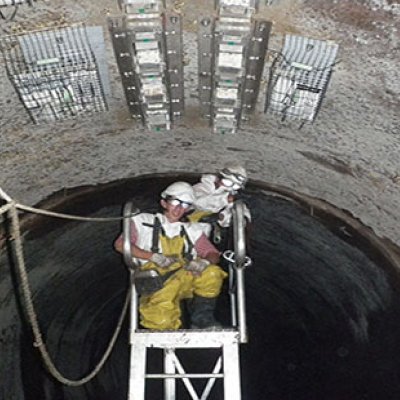 Researchers installing/retrieving coupons in a Gold Coast sewer