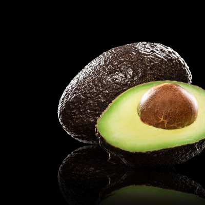 Avocado on black background.