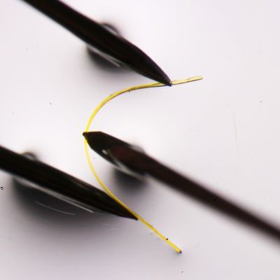 a fine yellow filament is bent between three black points