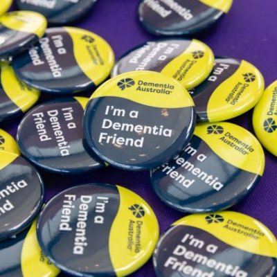 Close up of a button that says 'I'm a dementia friend'