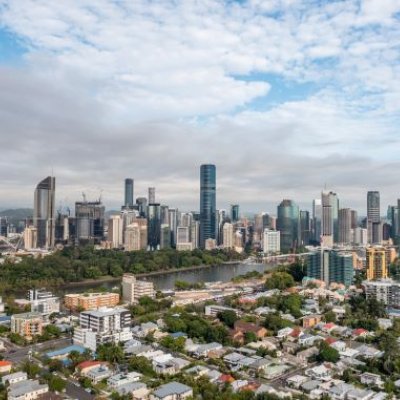 A wide view of a city skyline including high rises and residential housing