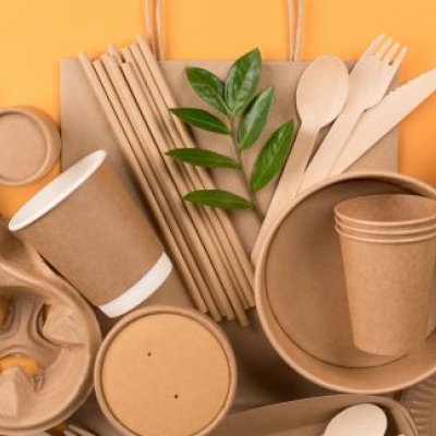a pile of brown boxes, cups and utensils