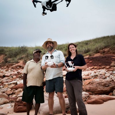 Goolarabooloo Law Boss Phillip Roe, Dr Steve Salisbury and Linda Pollard use the dino-drone. Photo: Damian Kelly.