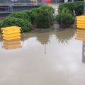 The Flood Tuff units in action protecting traffic management systems from flood waters. Image: TMR