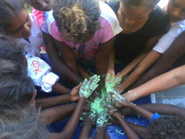 Kowanyama students taking part in a 'slime rising' experiment