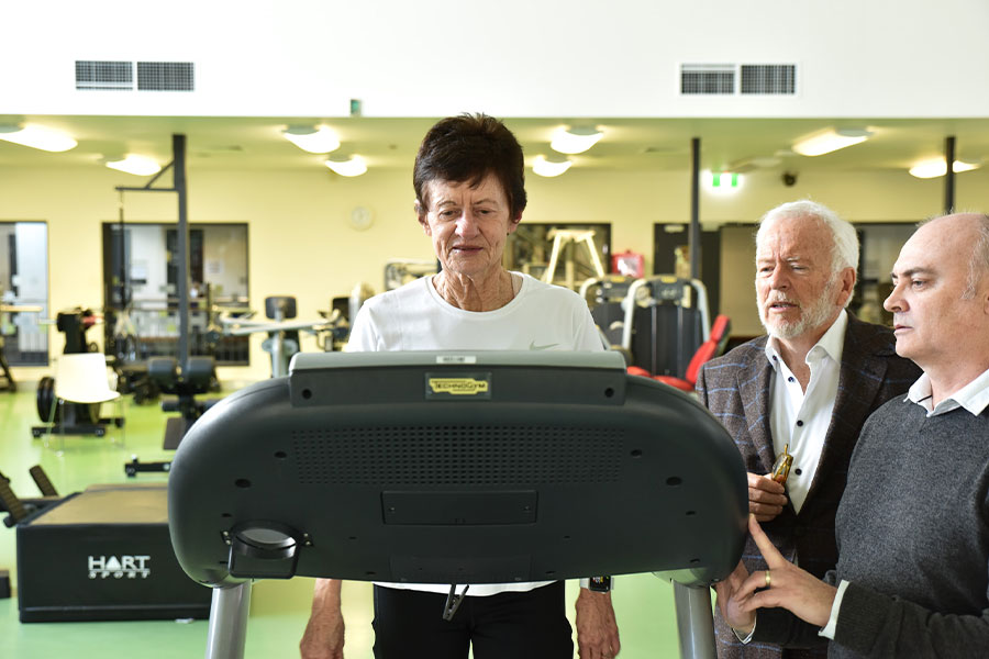An image of Denise Spensley walking on a treadmill under the supervision of Emeritus Professor Perry Bartlett (and Dr Daniel Blackmore.