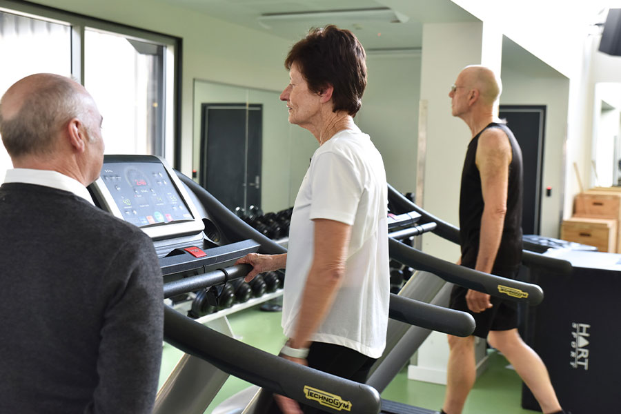 A side-on image of Denise Spensley exercising on a treadmill