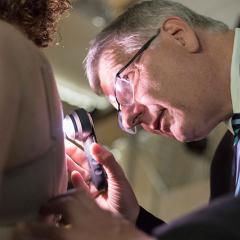 Professor H Peter Soyer examining a patient