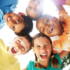 Smiling children in a huddle