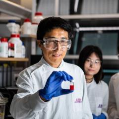 Team of UQ researchers in a lab