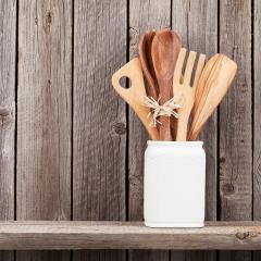 wooden kitchen utensils on a shelf